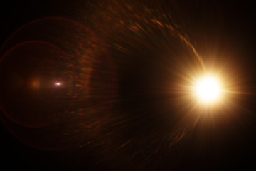 Easy to add lens flare effects for overlay designs or screen blending mode to make high-quality images. Abstract sun burst, digital flare, iridescent glare over black background.