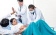 © Anatta_Tan - The teamwork of doctors and fathers, who are enjoying which the touch and movement of the baby in wife womb which lying in the patient's bed, to maternity health and family concept.