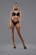© serhiibobyk - Woman in lingerie isolated on grey.