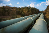 Fototapeta Łazienka - Huge pipelines in rural landscape.