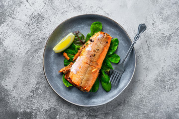 Sticker - Top view of plate with red salmon baked in oven with spice