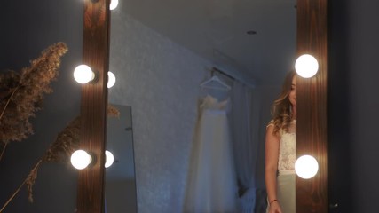 Wall Mural - Beautiful girl model posing in front of a mirror.