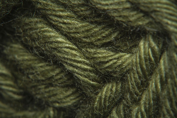 Close-up macro shots a green wool thread on the wool thread ball