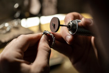 Close-up Of A Goldsmith Hand's Grinding A Silver Ring