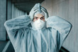© Westend61 - Portrait of despaired man wearing protective clothing