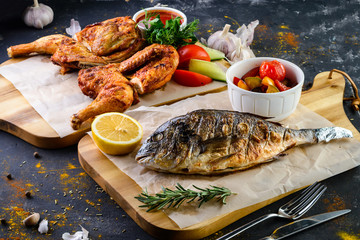 Wall Mural - grilled fish dorada bbq still life