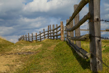 Part Of A Wooden Fence Against The Backdrop Of Mount Petros. Carpathian Landscape. Ukraine
