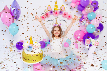 Unicorn Girl throws confetti. Idea for decorating unicorn style birthday party. Unicorn decoration for festival party girl.