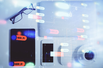 Double exposure of technology theme drawing over work table desktop. Top view. Global data analysis concept.