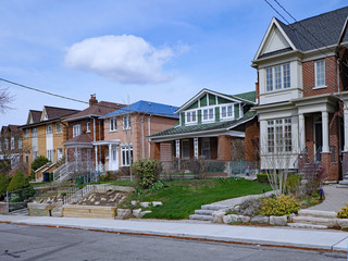 Wall Mural - Residential street with a variety of older and newer houses and a mix of detached and semi-detached