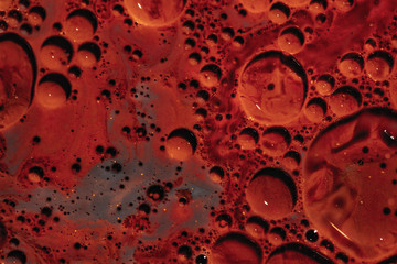 Color abstraction of oil in water. A close up of a round object. 