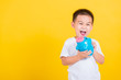 © sorapop - little cheerful child boy smile holding piggy bank