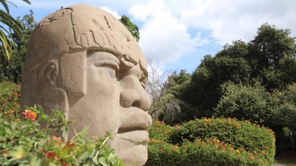 Wall Mural - Mexico Olmec Head with cloud timelapse