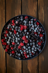 Wall Mural - frozen raspberries, blackberries and blueberries close up