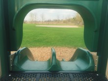 Close-up Of Green Slide In Park