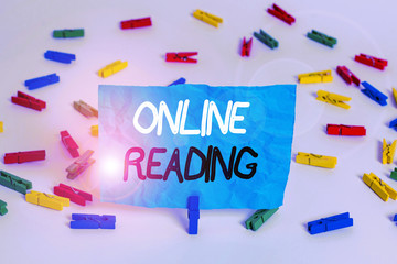 Poster - Handwriting text writing Online Reading. Conceptual photo process of extracting meaning is in a digital format Colored clothespin papers empty reminder white floor background office