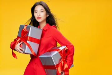 young woman with gift boxes