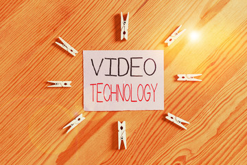 Fototapete - Handwriting text Video Technology. Conceptual photo recording and playing back of moving pictures and sound Colored clothespin papers empty reminder wooden floor background office