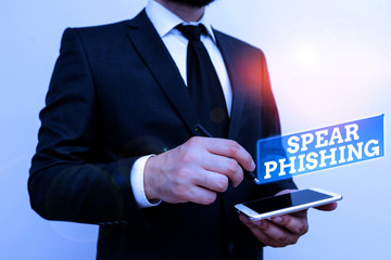 Poster - Text sign showing Spear Phishing. Business photo text Sending fake emails to extract financial data from user Male human wear formal work suit hold smart hi tech smartphone use one hand