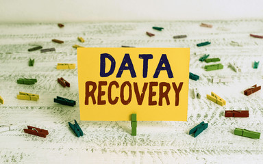 Fototapete - Conceptual hand writing showing Data Recovery. Concept meaning process of salvaging inaccessible lost or corrupted data Green clothepin white wood background reminder office supply
