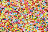 Colorful confetti sprinkles textured background