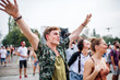 © Halfpoint - Group of young friends at summer festival, dancing.