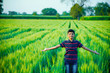 © PRASANNAPIX - indian cute little boy spreading his arms at field
