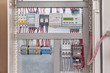 © AndreiNN - Control relay with screen, power supply, contactor or starter with thermal relay, circuit breakers, terminals, phase and voltage monitoring relays, intermediate relays in the electrical Cabinet.
