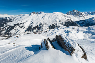 Panoramic view across snow covered alpine mountain range