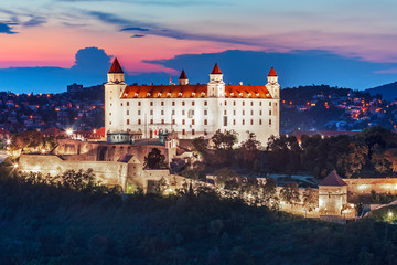 Poster - Bratislava castle over Danube river after sunset in the Bratislava old town, Slovakia