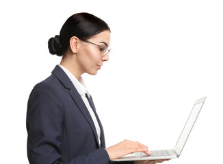 Wall Mural - Young businesswoman with laptop on white background