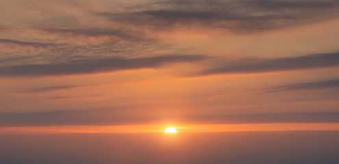 Poster - beautiful coudscape at sunset with sun and red clouds