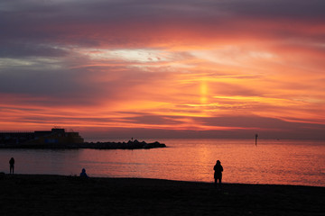 Wall Mural - Barceloneta beach at sunrise in Barcelona, Spain