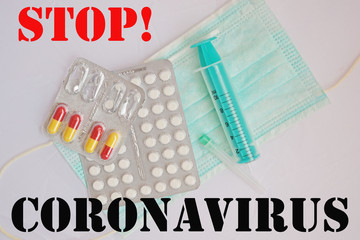 Medical mask and medication on a white background.Stop!Coronavirus.Stop COVID-19,together.