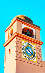 Wall Mural - Clock tower of Church of Santo Stefano on Capri Island reflex