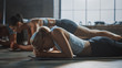 © Gorodenkoff - Strong Masculine Man and Two Fit Atletic Women Hold a Plank Position in Order to Exercise Their Core Strength. Blond Girl is Exhausted and is Struggling with Training. They Workout in a Loft Gym.