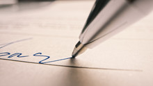 Person Signing Important Document. Camera Following Tip Of The Pen As It Signs Crucial Business Contract. Mock-up "Lorem Ipsum" Signature Made On The Template Document. Macro Close-up Shot