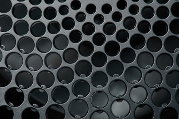 Perforated black matte surface