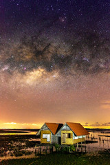 Wall Mural - the milky way (bridge over thale noi and twin houses, phatthalung province, thailand) on a clear cle