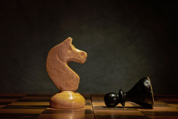 Black and white photo with a picture of a chess Board and chess pieces, Wooden chess pieces on a chess Board