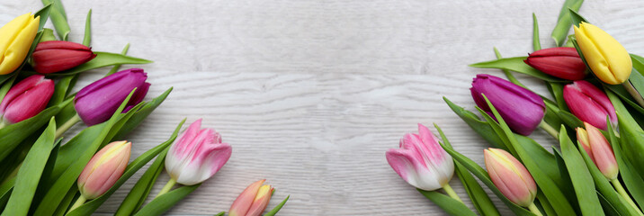 Sticker - bouquet of tulips on wooden background