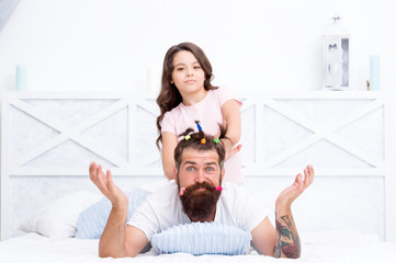 Wall Mural - Creative girl. childrens day. love and trust. daughter and father with funny hairdo. hairdresser and barbershop. happy family day. small girl play with dad. bearded man father having fun with kid