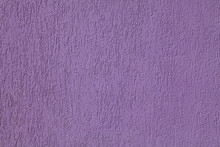 Purple Wall, Texture, Background. Plastered Building Wall, Painted With  Violet Water-based Paint. Decorated Surface With Embossed Pattern. Elements Of The Exterior And Interior