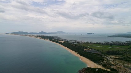 Wall Mural - Aerial view of Dai Lanh beach, Van Ninh, Khanh Hoa. Situated at the south central coast of Vietnam,a two-kilometre bay with a fishing village at one end & a beach at the other