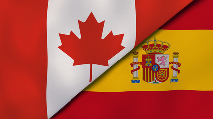 The flags of Canada and Spain. News, reportage, business background. 3d illustration