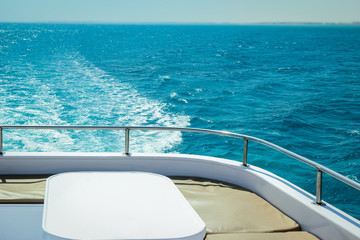 A Yacht at sea table on the deck Rest in a ship for vip persons on water background.