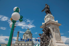  July 2012 -Monument To Samuel De Champlain, Founder Of The Quebec City With The Old Post Office Tower In The Back, Place D'Armes, Quebec City, Canada