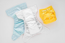 Reusable Cloth Baby Diapers. Eco Friendly Cloth Nappies On A White Background. Sustainable Lifestyle.  Zero Waste Concept.