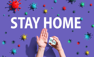 Wall Mural - Stay home theme with person using hand sanitizer