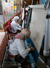 Berber Women Crafting Carpets With Wooden Loom In Tunisia